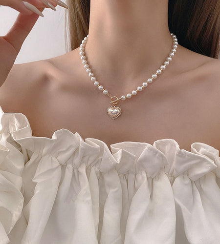 Pearl Necklace
Introducing our stunning Pearl Necklace, the perfect accessory to elevate any outfit! The lustrous pearl beads exude elegance, while the sparkling rhinestone heart necklaceHi Tech Glam LtdPearl Necklace