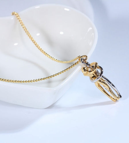 Couple Hugging Pendant NecklaceIntroducing our Couple Hugging Pendant Necklace, a stunning piece of jewelry that is perfect for any fashion-forward woman. This necklace is not only a beautiful accjewelryHi Tech Glam LtdCouple Hugging Pendant Necklace